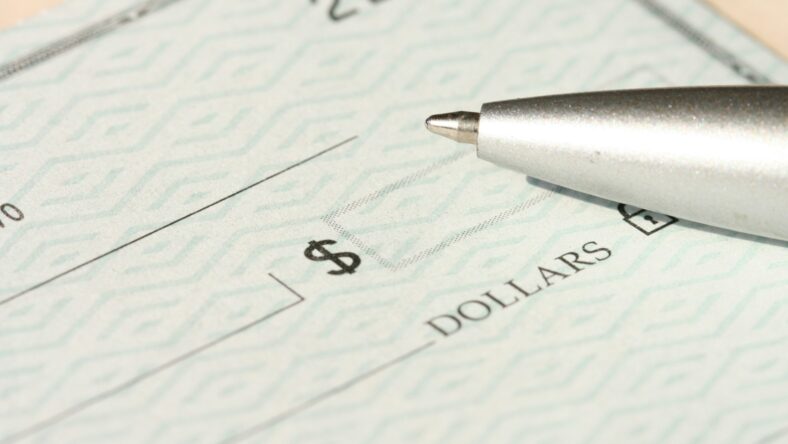 checkbook with pen / irregular pay / paycheck