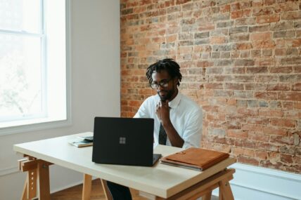 man sitting at desk / solopreneur