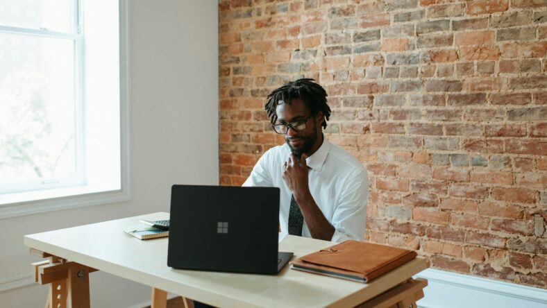 man sitting at desk / solopreneur