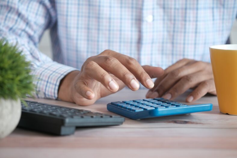 man with calculator / social security myths