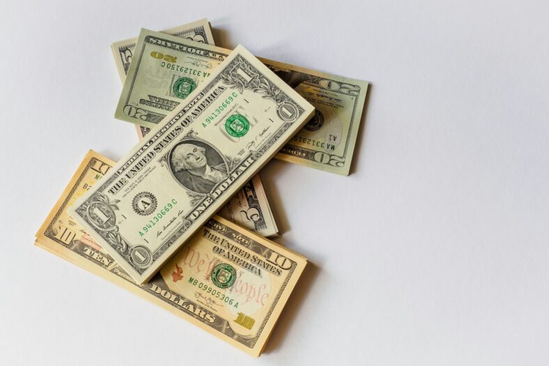 money scattered on table