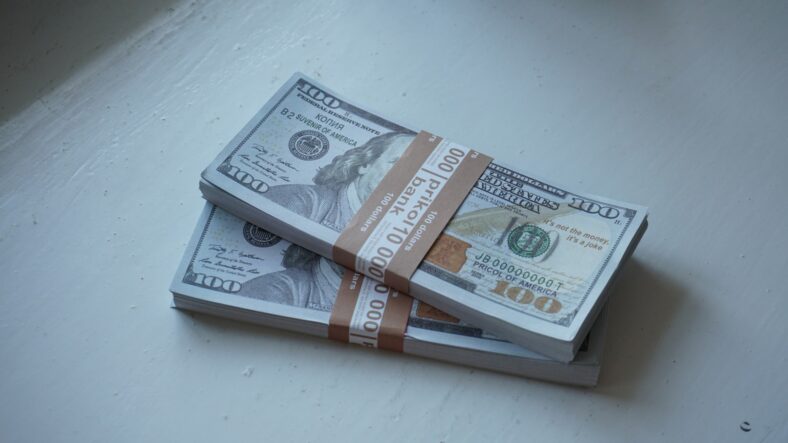 stacks of 100 dollar bills